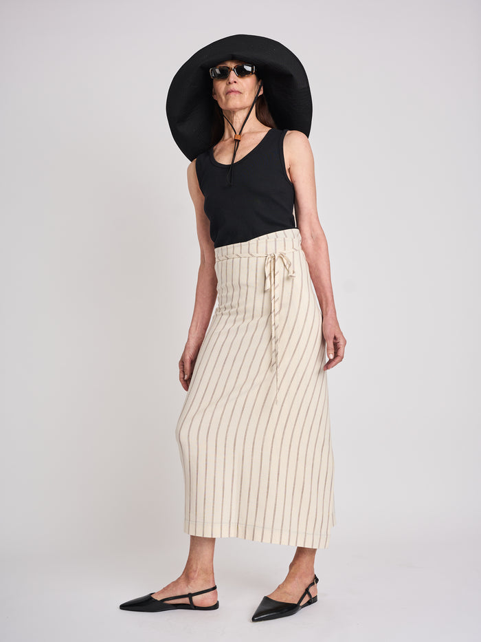 The Lucie Marquis ‘Rae Midi’, a timeless midi-length wrap skirt. An essential holiday item - this versatile piece, effortlessly transitions from day to night, making it ideal for all travel adventures. Whether lounging by the pool or exploring city life, the Rae Midi adds elegance to any ensemble.