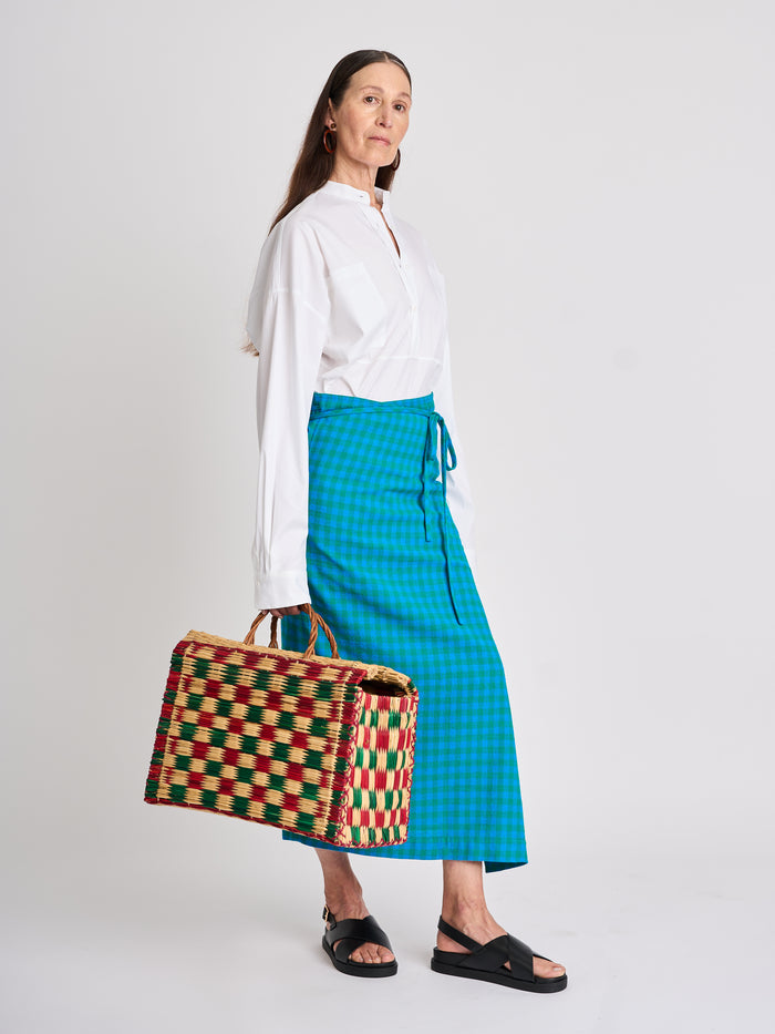 The Lucie Marquis ‘Rae Midi’, a timeless midi-length wrap skirt. An essential holiday item - this versatile piece, effortlessly transitions from day to night, making it ideal for all travel adventures. Whether lounging by the pool or exploring city life, the Rae Midi adds elegance to any ensemble.