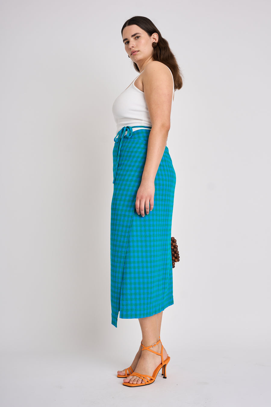 The Lucie Marquis ‘Rae Midi’, a timeless midi-length wrap skirt. An essential holiday item - this versatile piece, effortlessly transitions from day to night, making it ideal for all travel adventures. Whether lounging by the pool or exploring city life, the Rae Midi adds elegance to any ensemble.